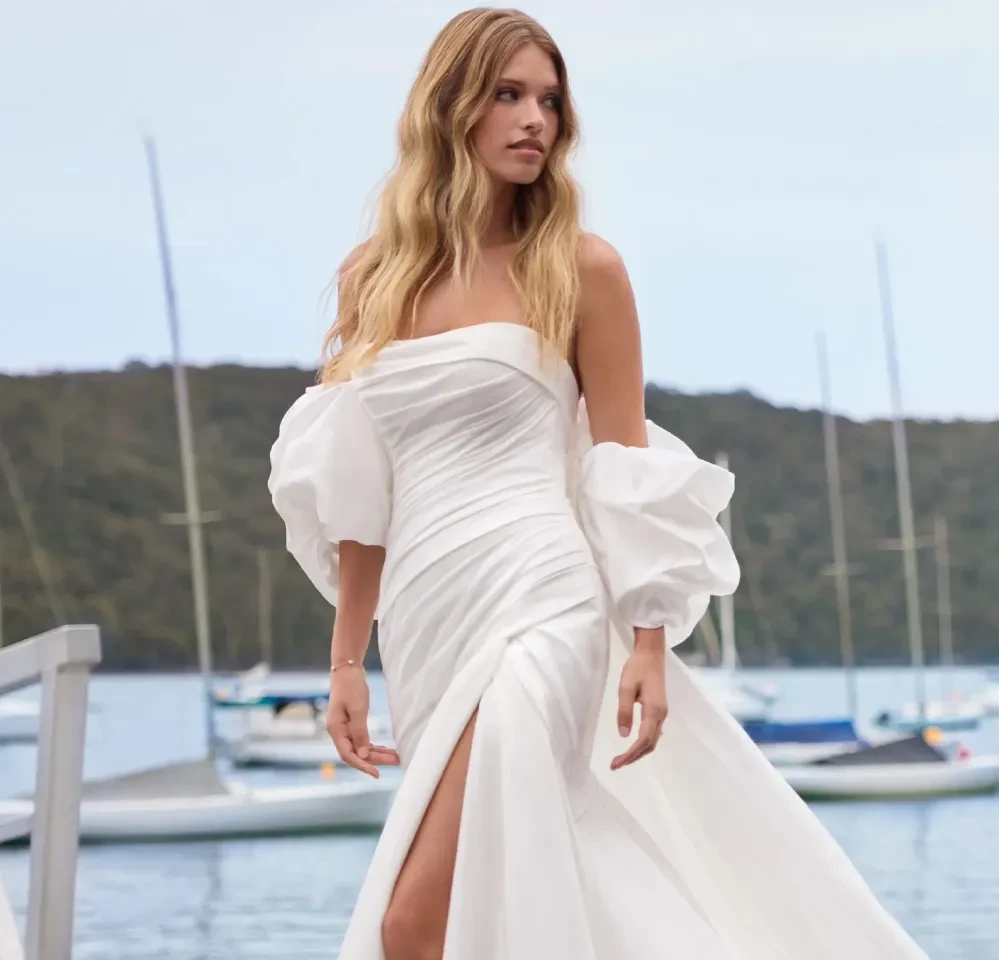 Model wearing a gown by Sophia Tolli