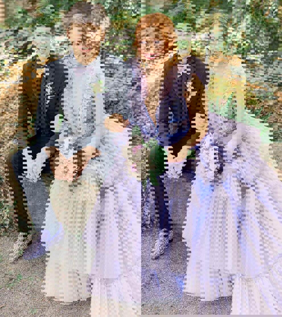 Сouple wearing a pink gown and a black suit