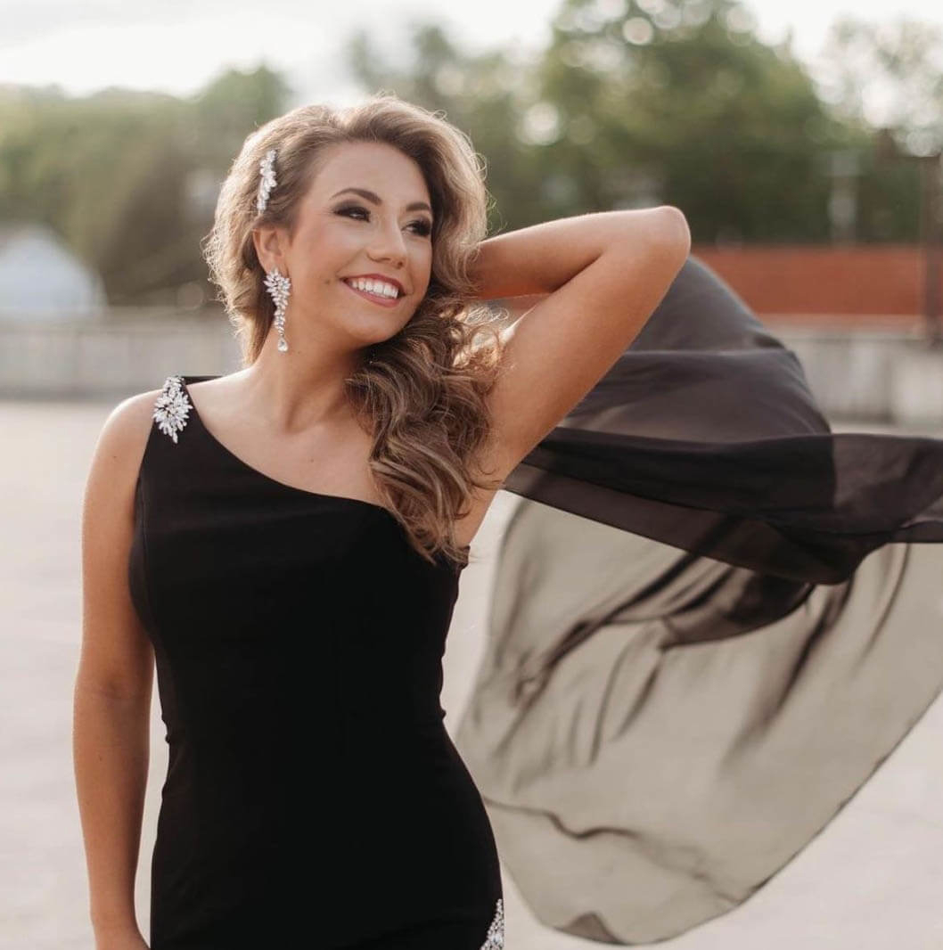 Model wearing a black dress